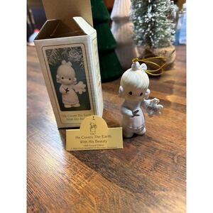 Precious Moments 1995. He covers the earth with his beauty figurine.  New in box